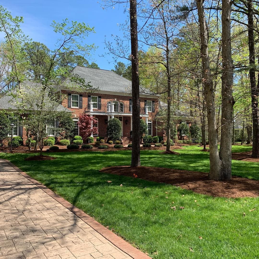Completed ATS&L residential project with fresh mulch and stamped walkway in Central Virginia