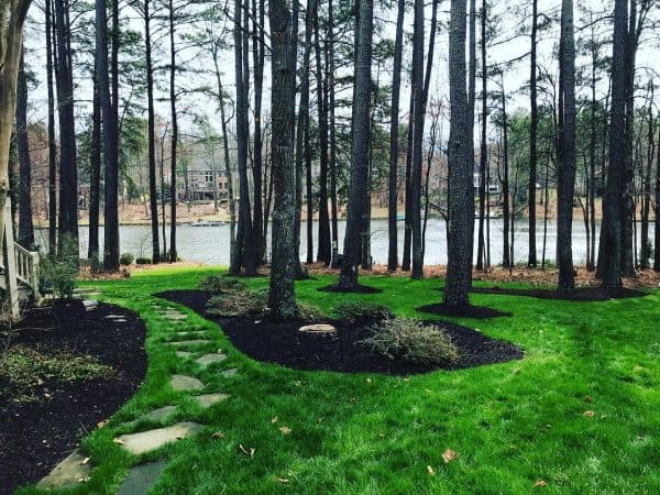 Freshly landscaped front yard with mulched beds and shrubs in Central Virginia