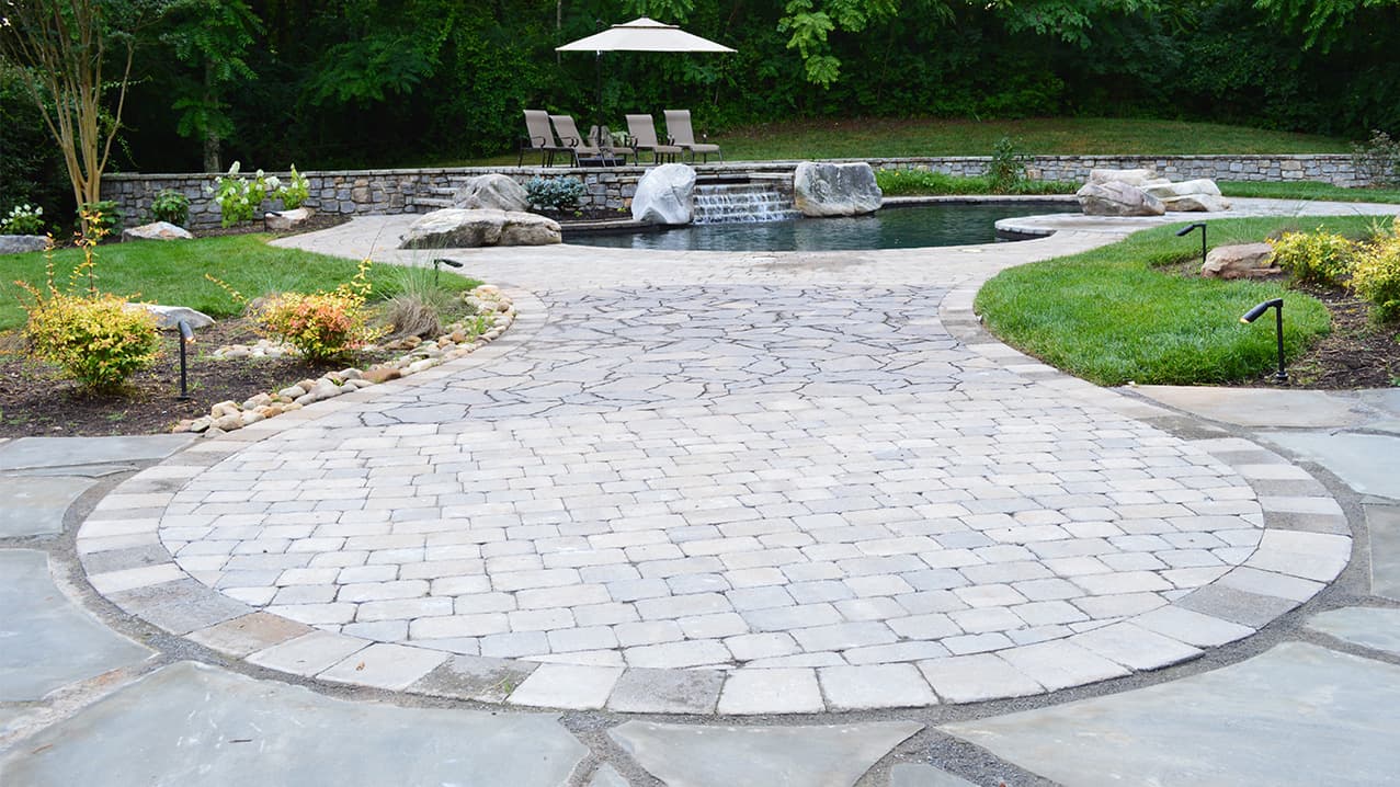 Newly installed paver patio with clean joints beside a Central Virginia home